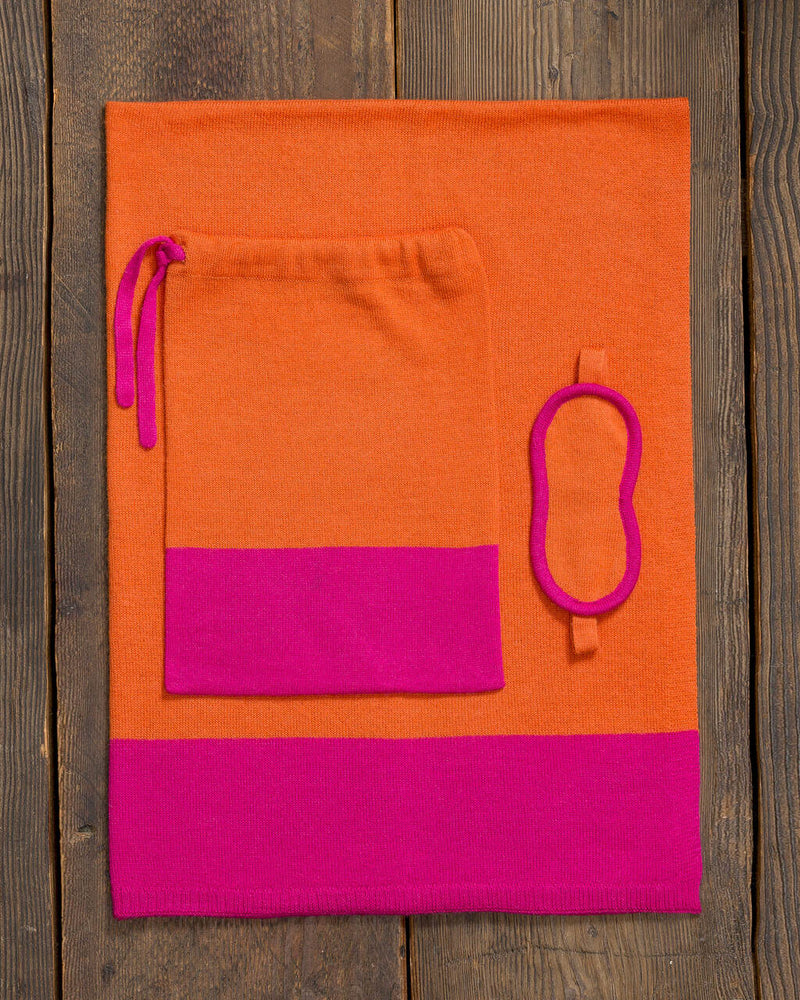 Alicia Adams Alpaca Nomad Travel Set, alpaca gifts, alpaca travel blanket, airline travel kit with blanket and eyemask, firecracker orange and shocking pink alpaca travel set