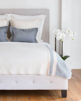 Ivory, taupe and blue multicolor Alicia Adams Alpaca Field Blanket in room setting ecofriendly recycled alpaca and wool handstitched blanket, famous designer, today show alpaca blanket, alicia adams today show
