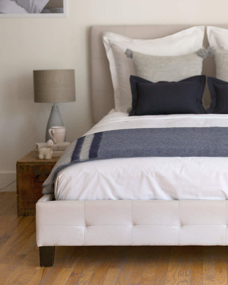 Blue and cream multicolor Alicia Adams Alpaca Field Blanket in room setting ecofriendly recycled alpaca and wool handstitched blanket, famous designer, today show alpaca blanket, alicia adams today show