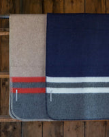 Paprika orange, light taupe, charcoal grey, light grey, navy multicolor Alicia Adams Alpaca Field Blanket in room setting ecofriendly recycled alpaca and wool handstitched blanket, famous designer, today show alpaca blanket, alicia adams today show