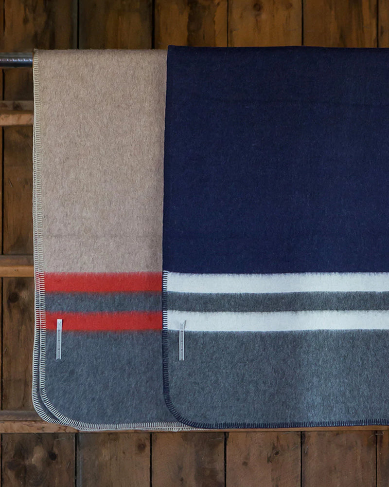 Paprika orange, light taupe, charcoal grey, light grey, navy multicolor Alicia Adams Alpaca Field Blanket in room setting ecofriendly recycled alpaca and wool handstitched blanket, famous designer, today show alpaca blanket, alicia adams today show